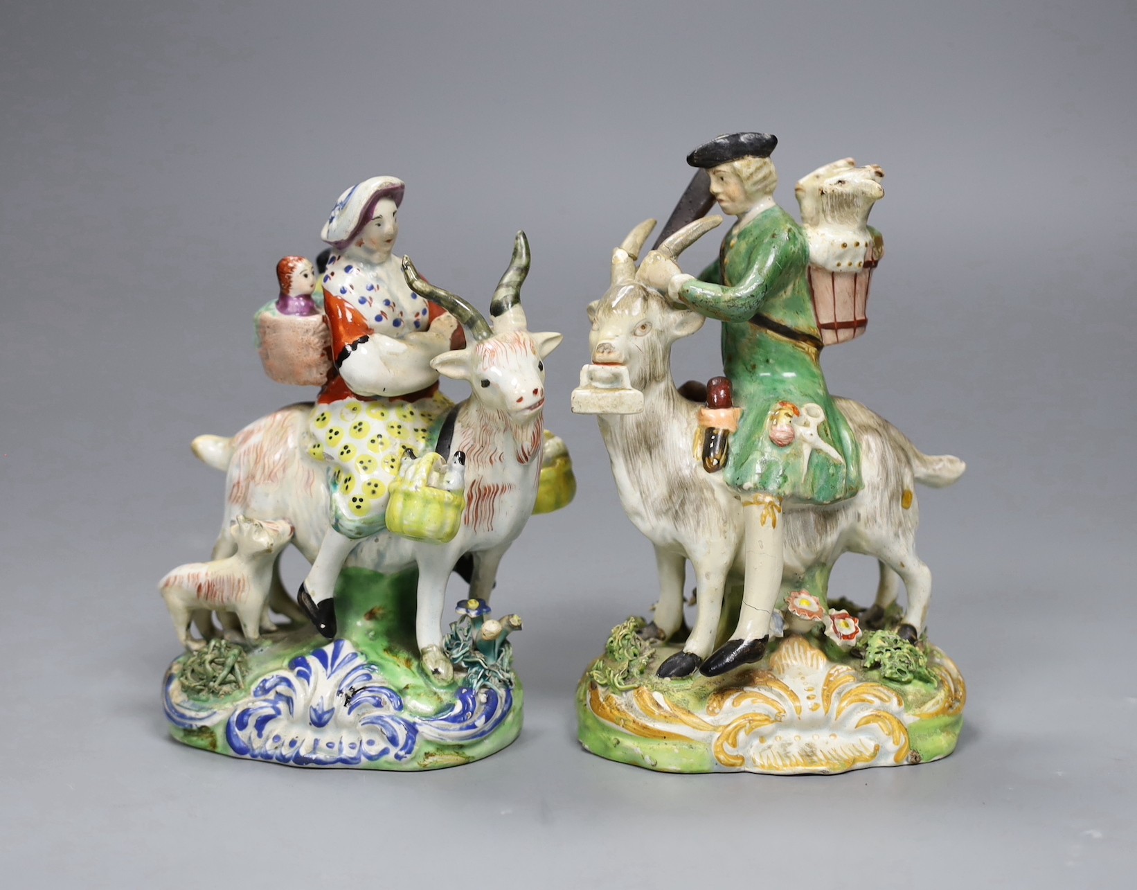 A near pair of pearlware groups Tailor and his wife, c.1820, tallest 13.5cm